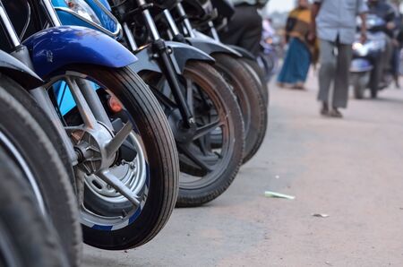 Row of polluting motor bike parked in Calcutta, India.