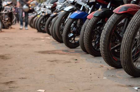 Row of polluting motor bike parked in Calcutta, India.