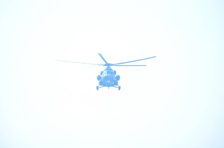 Photograph of a helicopter is flying in sky.のeditorial素材