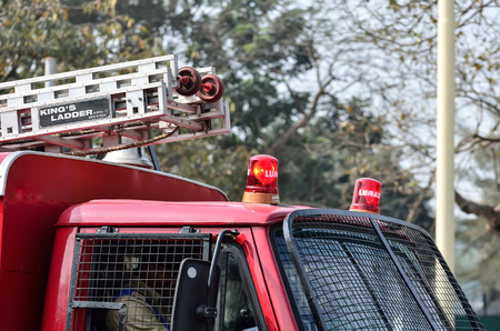 Emergency siren on top of car. Fire Brigade in road. In a emergency service fire brigade running on...