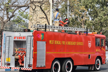 Indian fire brigade is running in road. West Bengal fire brigade.