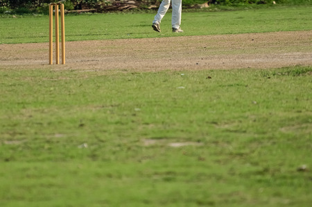 Cricket game was playing in field at Kolkata by boyの写真素材