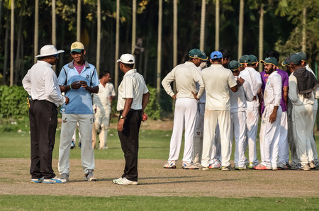 Enjoyment fall of wicket. Boys are playing cricket on Maidan area at Calcutta, India. Maidan is a public place and anyone can capture photograph. There is no ticket, anyone can see.のeditorial素材