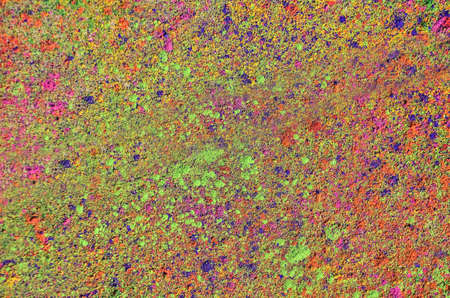 Colorful background with Holi powder. Holi is a festival celebrated in spring by Hindus, Sikhs and...