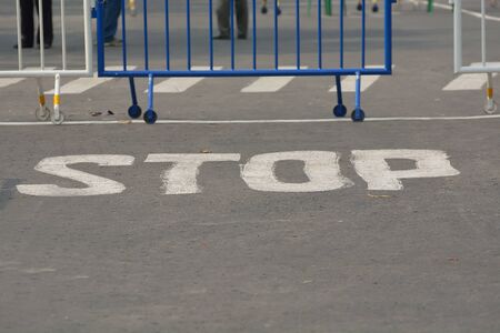 Road is closed by fence.