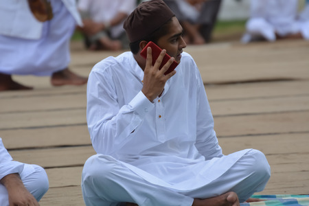 Indian Muslims are celebrating Eid in Calcutta. Their are praying to allah. Muslims on the road during the EID festival to  rad namaz in Calcutta, India.のeditorial素材