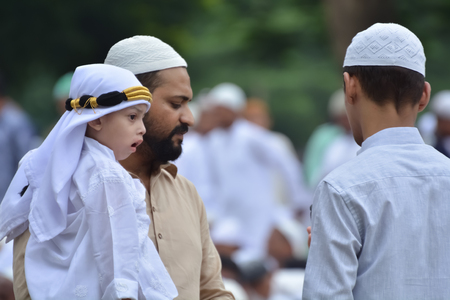 Indian Muslims are celebrating Eid in Calcutta. Their are praying to allah. Muslims on the road during the EID festival to  rad namaz in Calcutta, India.のeditorial素材