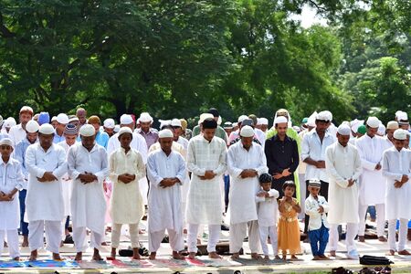 Indian Muslims are celebrating Eid in Calcutta. In Eid they are praying to Good on road in a...