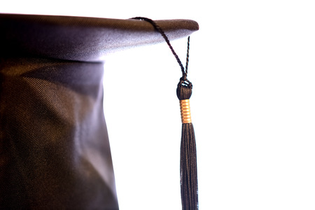 Young Man in a Graduation cap wear on isolated whiteの写真素材