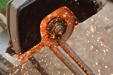 A construction worker is cutting a iron roadの写真素材