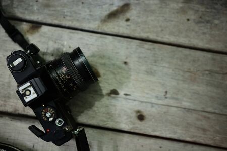 Analog film camera on wooden backgroundの写真素材