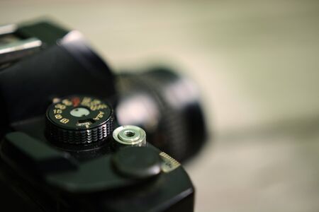 Close up of analog film camera on wooden backgroundの写真素材