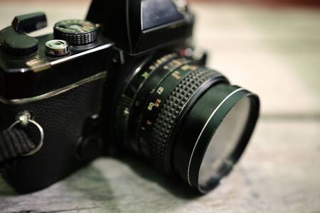 Close up of analog film camera on wooden backgroundの写真素材