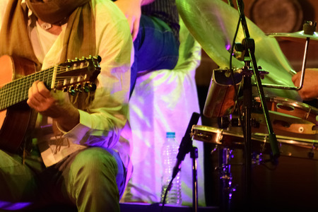 Playing acoustic guitar in a music festivalの写真素材