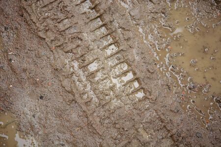 wheel track on dirty soil.