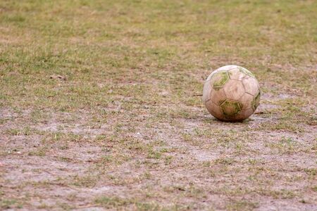 soccer ball on empty soccer pitchの写真素材