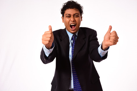 Exiting businessman thumbs-up on isolated backgroundの写真素材