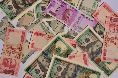 Indian money and dollar and sixes and seven
