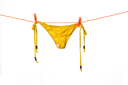 Bikini hanging on white backgroundの写真素材