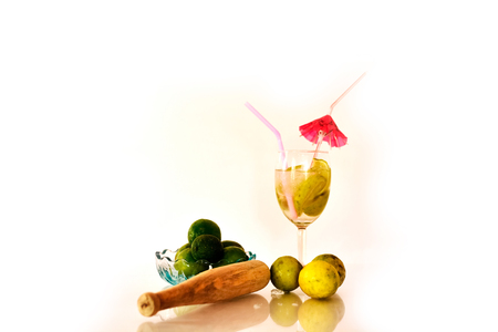 Cocktail with fresh limes on white background.の写真素材