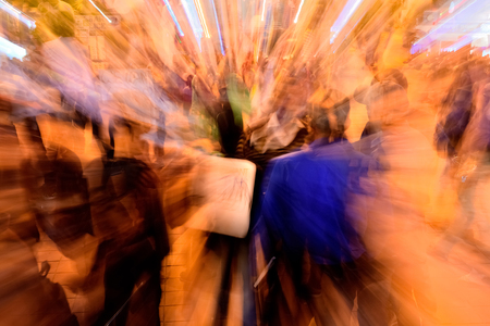 Night Crowds are in the downtown area. Zoom blur with long exposure in crowded area.の写真素材