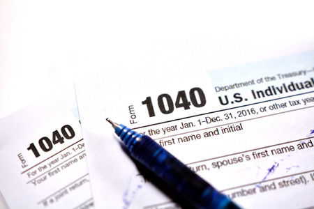 American tax form 1040 on white background. Fill-up American tax form.の写真素材