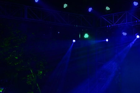 Stage Spotlight Beams against dark black