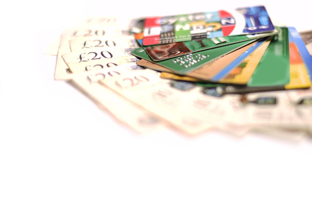 British pound currency and credit card on white backgroundの写真素材