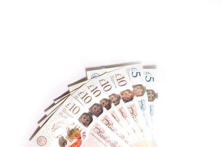 Pound sterling paper currency on white backgroundの写真素材