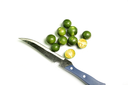 Green lemons isolated on white backgroundの写真素材