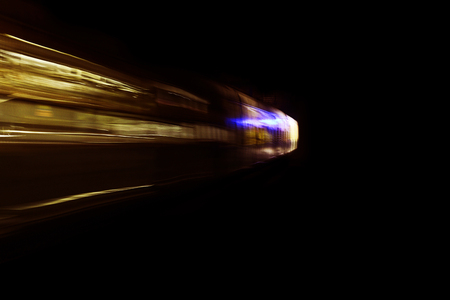 Car moving on highway against dark night, photograph is taken with long exposure.の写真素材