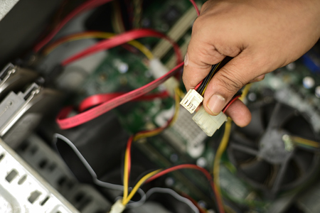 Wiring electric wire in a computer mother board.の写真素材