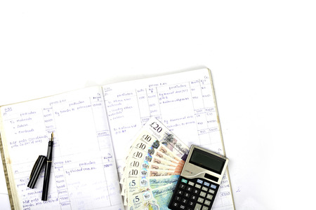 Accounting British currency pound sterling isolated on white background.