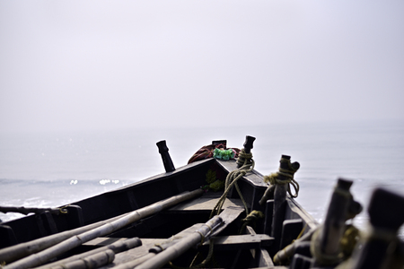 Close-up of empty fishing boat in sea beach.の写真素材