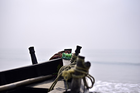 Close-up of empty fishing boat in sea beach.の写真素材