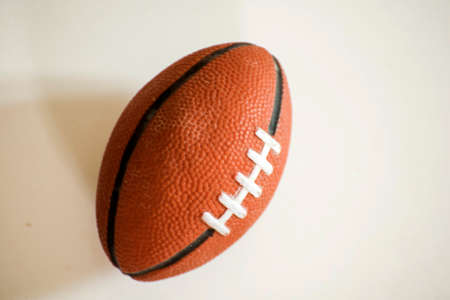 Close-up of rugby ball isolated on white background
