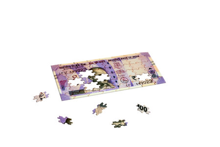 One Hundred Indian currency puzzle with three pieces moved on isolated white background