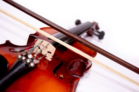 Front view of violin with Violin stick isolated on white backgroundの写真素材