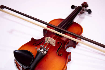Front view of violin with Violin stick isolated on white backgroundの写真素材