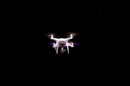 Drone is flaying against isolated black backgroundの写真素材