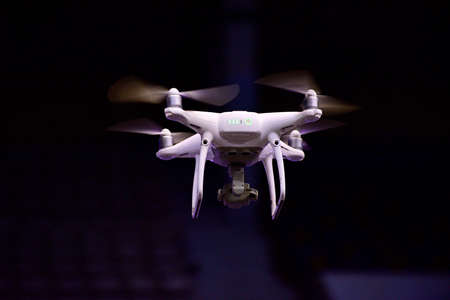 Drone is flaying against isolated black backgroundの写真素材