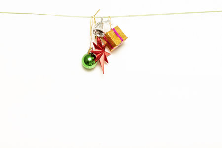 Christmas gifts are hanging on isolated white backgroundの写真素材