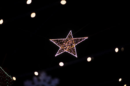 LED Christmas lighting decoration isolated against black background.