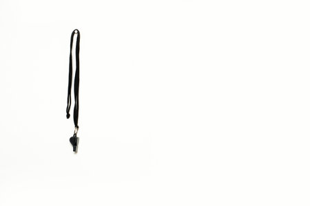 Soccer whistle hanging isolated on white backgroundの写真素材