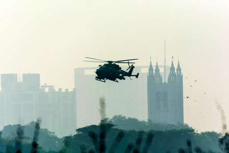 Silhouette of helicopter flying in the air over Kuala Lumpur, Malaysiaの写真素材
