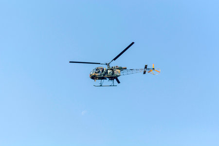helicopter flying in the blue sky, closeup of photoの写真素材