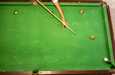young pro billiard player finding best solution and right angle at billard or snooker pool sport gameの写真素材