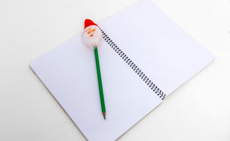 Empty exegesis book with Santa pencil on tableの写真素材