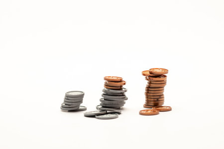coin increasing like a bar graph isolated on white tableの写真素材