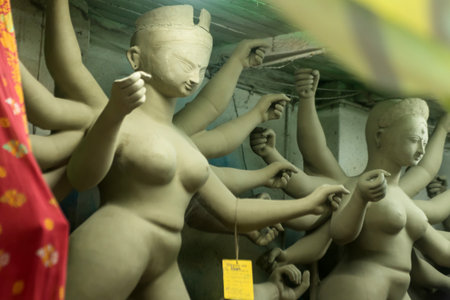 Goddess idols are being prepared with clay before festival. Idols being made for Durga Puja festival.の写真素材